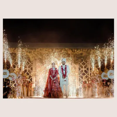 A grand finale for a grand wedding. The fireworks and cold pyros create a spectacular backdrop for the couple's stage moment, a truly cinematic celebration.