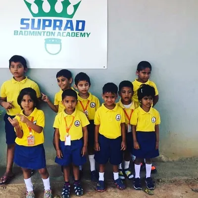 A group of our youngest players from a local school posing proudly outside the academy. Our kids' badminton classes are a great way for them to build confidence and make new friends.