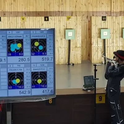 Live scoring displayed on a large screen during the 10-meter air rifle qualification round at the National Championship.