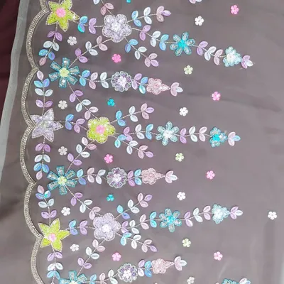 A close-up of the colorful floral hand embroidery I created for a light gold lehenga. Instead of traditional gold or silver, I used a pastel palette of sequins and beads to create a fresh, modern, and whimsical design.