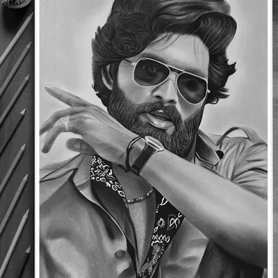 The finished portrait of Allu Arjun as Pushpa. This detailed graphite sketch on A3 paper captures his intense look and iconic style from the movie.