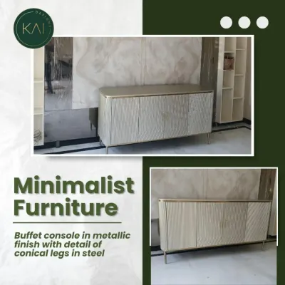 This minimalist buffet console features a metallic finish and textured door fronts. The sleek, conical steel legs provide a delicate contrast to the solid body, making it a sophisticated statement piece for a dining or living area.