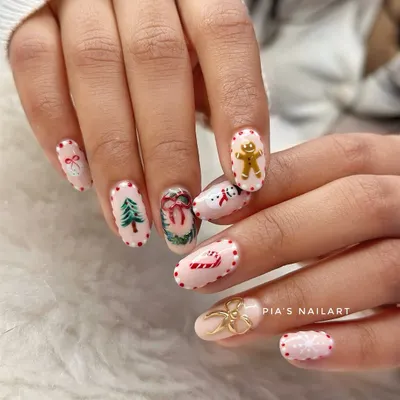 The cutest holly jolly Christmas nails. This set has it all: a hand-painted gingerbread man, Christmas tree, snowman, candy cane, and a 3D gold bow.