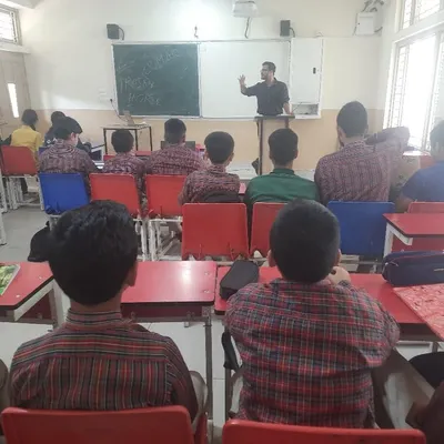 An instructor at DAV Public School Sundernagar explains a cybersecurity concept at the whiteboard. Our workshops are designed to be engaging and informative.