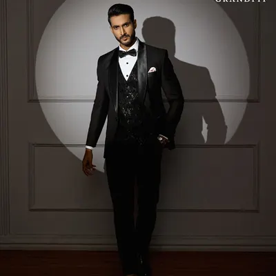 Step into the spotlight with a tuxedo that is built for the occasion. This ensemble, featuring a subtly textured waistcoat, is designed to look impeccable under event lighting.