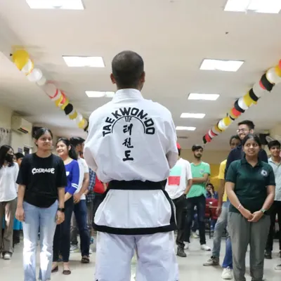 Addressing a group of students at the start of a self-defense workshop. I always begin by setting the context: this is about empowerment, awareness, and building confidence, not aggression.