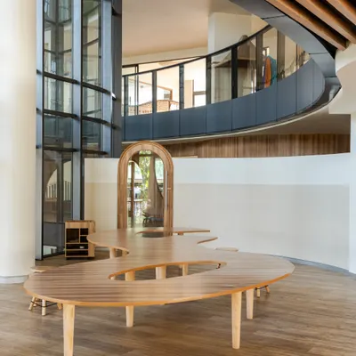 At Vedanya School, a compact site inspired an imaginative design. This image shows how curved forms, double-height volumes, and layered connections create an interconnected environment that encourages movement and exploration for young learners.
