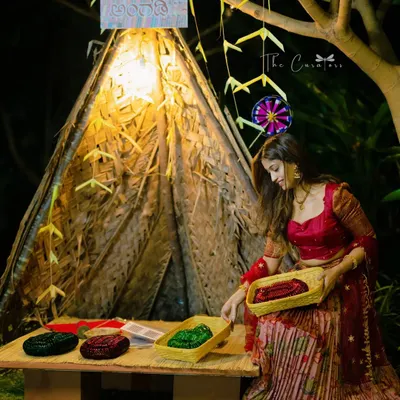 We created this 'Balle Angadi' (bangle shop) photobooth from natural materials, complete with a rustic tent and colorful bangles for guests to try on and take home.