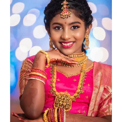 A classic portrait from Harshitha's half-saree ceremony. We work closely with our clients to create beautiful, well-lit portraits that become cherished family heirlooms.