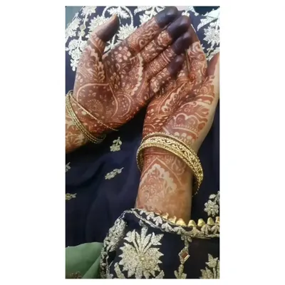 A close-up of the beautiful, dark henna stain after the paste has been removed. The rich color on the palms and fingers is a sign of high-quality, natural henna.