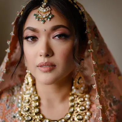 A classic bridal portrait that focuses on the intricate details of the bride's attire and her calm, confident expression. I use soft, natural light to highlight features and create a timeless, high-end look that still feels completely authentic to you.