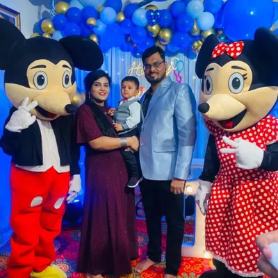 It's not just about decorations; we bring the fun too. Here, our Mickey and Minnie Mouse mascots are posing with the family, making the little one's birthday party extra special and interactive.