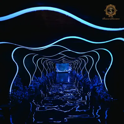 I designed this entrance to be an experience in itself. Guests walked through a dynamic, wave-like tunnel lined with blue neon lights, immersing them in the cosmic theme before they even entered the main hall.