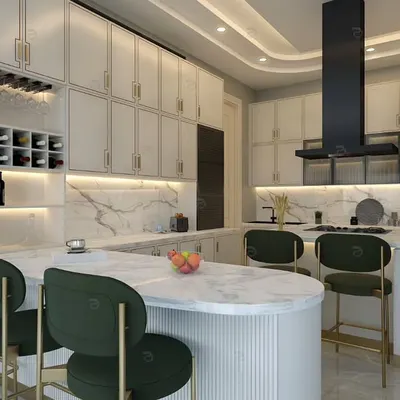 This view highlights the kitchen's spacious island, which doubles as a breakfast bar with stylish green and gold stools. The integrated wine rack adds a touch of sophistication.