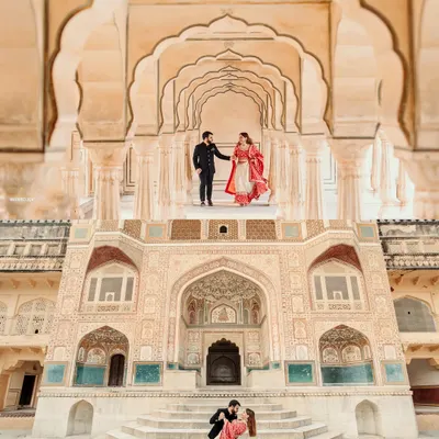 A truly majestic moment captured at Amer Fort in Jaipur. I love using grand architecture to frame a couple's story, creating a sense of scale and timelessness. This shot combines a classic pose with a dynamic dip, showing how we can blend traditional elegance with modern romance for your destination pre-wedding shoot.