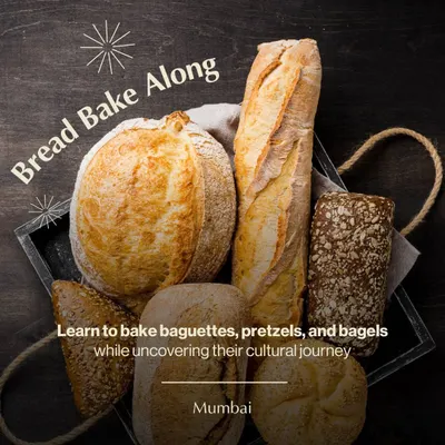 An assortment of freshly baked breads, including a rustic boule and a classic baguette. Our bread bake-along in Mumbai teaches you how to create these artisan loaves at home.