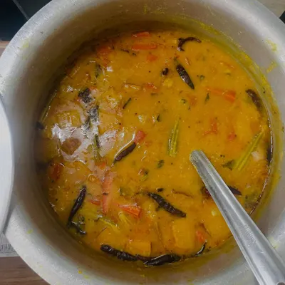 A comforting bowl of our homemade Sambhar, cooked with vegetables and lentils. It's the perfect accompaniment to our South Indian dishes.