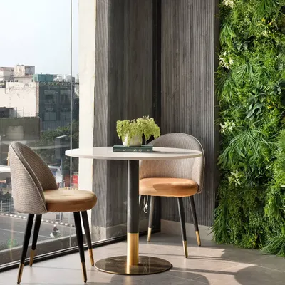 This corner of our modern office project is a perfect haven for deep work. A lush green wall adds a touch of organic drama, proving that even the most modern spaces can nurture the soul.
