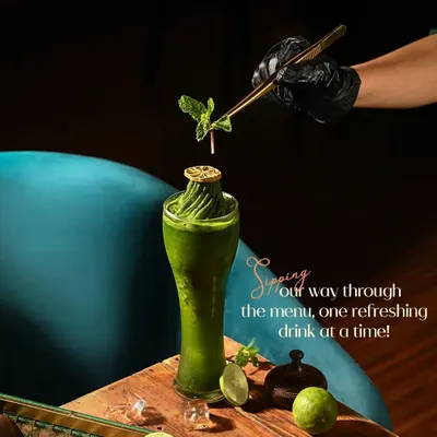 This is our refreshing mint and lime creation, a perfect example of how we use fresh, vibrant ingredients. Each drink is crafted to be a visual delight, garnished with care before it reaches your table.