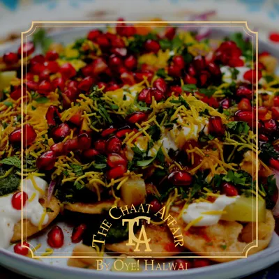 Our Papdi Chaat is a symphony of flavors and textures. It's loaded with fresh pomegranate, fine sev, and a perfect balance of sweet and spicy chutneys over a bed of creamy yogurt and crisp papdi.
