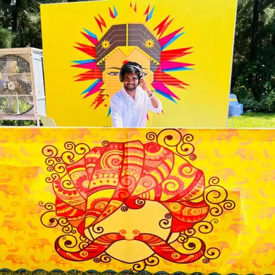 The vibe for a Haldi ceremony is all about bright colors and happiness. I love working with themed backdrops like this one to create the perfect daytime party atmosphere.