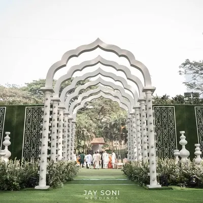 First impressions are everything. I designed this dramatic, all-white architectural walkway to create a sense of awe and anticipation, guiding guests into a celebration that was both grand and elegant.