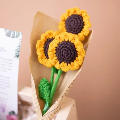 A charming bouquet of handmade crochet sunflowers, a unique and lasting floral touch that I include in many of my personalized birthday hampers.