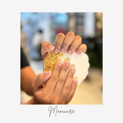 A perfect example of a classic French manicure. The clean white tips and natural pink base on these short, rounded nails create a look of effortless sophistication.