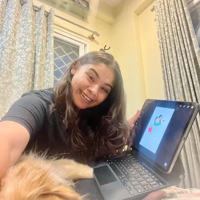This is me in my element, working on a new digital illustration. When I'm not teaching, I'm available for freelance design projects, including branding and custom creative work.
