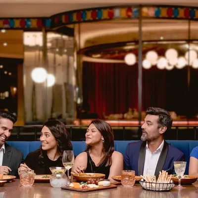 This "Last Supper" inspired group shot was a complex scene requiring precise direction for seven individuals. I worked closely with each person to stage a moment that felt natural yet highly stylized, showcasing my ability to manage large casts and create compelling narrative imagery for hospitality and lifestyle campaigns.