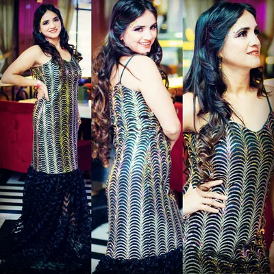 A custom-designed gown with a shimmering gold and black pattern and a dramatic ruffled trail. This is for those moments when you want to make a grand entrance and feel absolutely unforgettable.