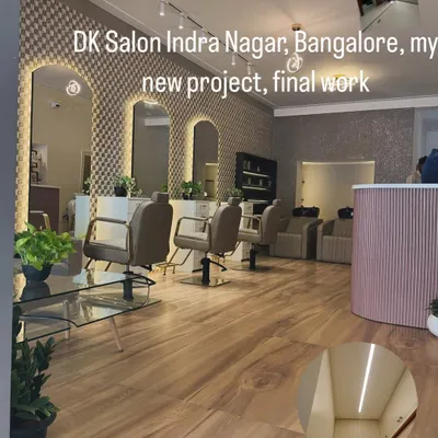 The final look of the DK Salon in Indra Nagar. We used a combination of textured wallpaper and premium paints to create a chic and inviting atmosphere for their clients.