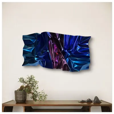 "Meteor Series M133" installed above a console. The deep blues and violets of this stainless steel piece are designed to shimmer like stardust, transforming an echo of space into a tangible work of art for the home.