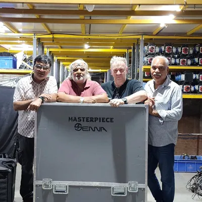 Our founder Mulchand Dedhia (second from left) and our team with a client, standing by a case for the Masterpiece Senna light. This photo represents our deep relationships within the industry and our access to world class lighting equipment.