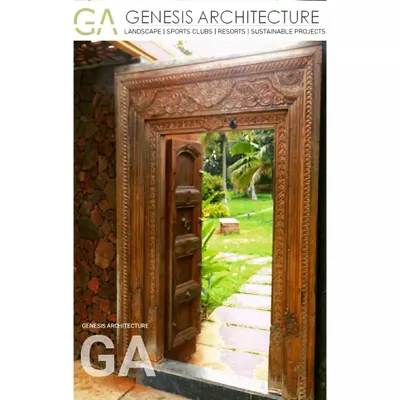 An antique carved wooden door opens to a lush garden path at a 3-acre farm land project near Bangalore. We developed this property as a holiday destination, planting over 250 native trees to support local bird life and create a true nature getaway.