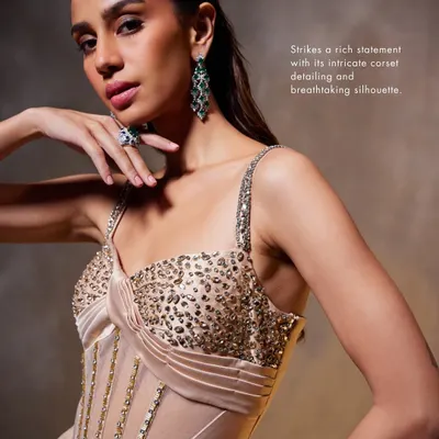 A detailed look at the corsetry of the Bella Gown. The sheer panels are combined with structured boning and hand-applied sequins to create a piece that is both delicate and strong.