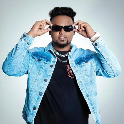 My style reflects my music. I bring a confident and authentic hip-hop persona to my work, which sets the tone for the entire event.