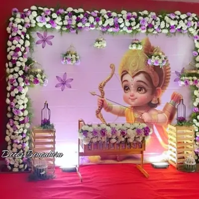 This Ram-themed naming ceremony for a baby boy was so special. The adorable depiction of Ram Lalla, framed by purple and white florals and balloon pillars, created a divine and cute atmosphere.