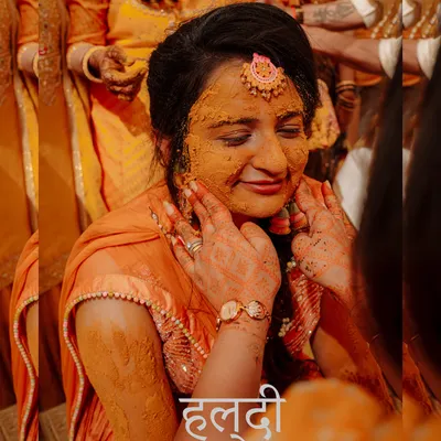 A beautiful close-up of a bride during her Haldi ceremony, her face glowing with turmeric and happiness. The text overlay adds a traditional touch to this joyful moment.