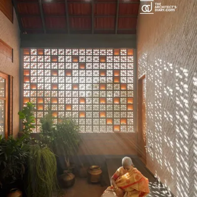 As featured in The Architect's Diary, this image of the Madhura house captures the serene moment when light filters through the jali screen, illuminating the courtyard.