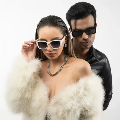 A high-fashion studio shoot with a "Fur and Leather" theme. This kind of dynamic duo shot is great for showing versatility in a model's portfolio and works well for campaign-style imagery.