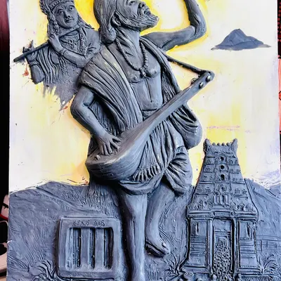 The completed clay mural of Kanaka Dasa, with added background color to highlight the detailed sculpture of the saint, Krishna, and the Udupi temple scene.