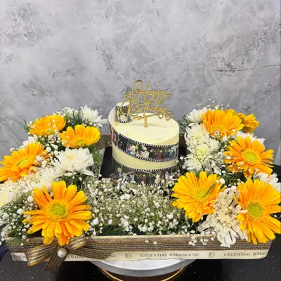 A beautiful gesture for a big celebration. This is our Memory Reel Cake nestled in our floral 'Celebration Cake Tray', making for a stunning and heartfelt birthday gift.