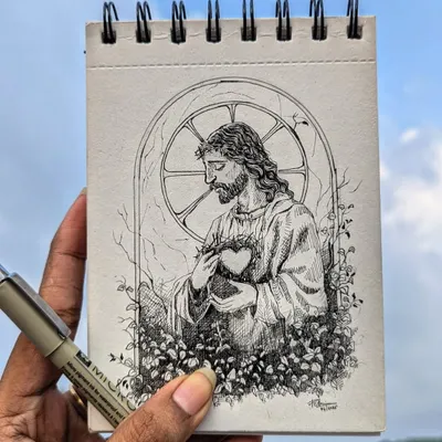 This detailed ink illustration of Jesus was drawn on the go, held up against the sky. It shows that inspiration can strike anywhere, and I'm always ready with my sketchbook and micron pen.