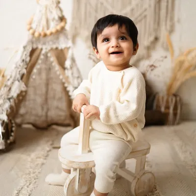 The purest, most joyful smile from a baby boy during his boho-themed sitter session. Capturing these happy expressions is the best part of my job.