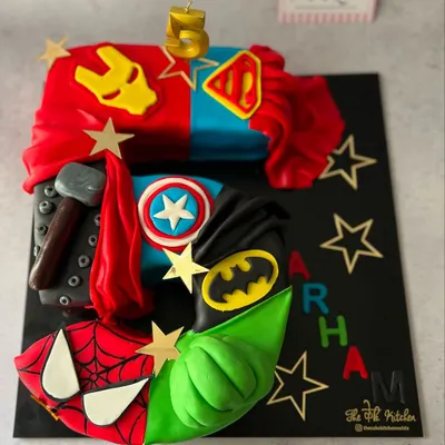 This is my most detailed themed monogram cake, featuring six different Avengers. I use fondant to sculpt specific details for each hero, making it a showstopper for a superhero-themed birthday party.