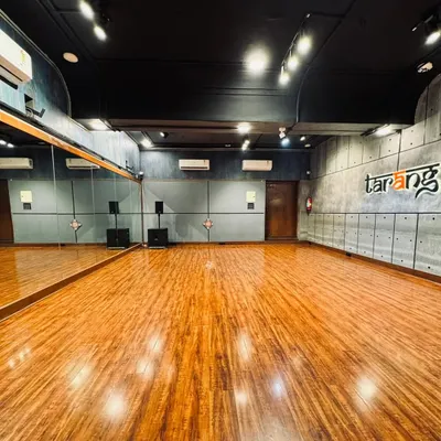 A full view of our main studio floor. The wide, open space with professional wooden flooring is perfect for group activities, allowing plenty of room for movement during dance workshops or for participants to lay down comfortably during meditation sessions.