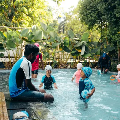 Play is the best way to learn. A coach engages with toddlers in our shallow pool, using games and gentle encouragement to build water confidence and develop motor skills.