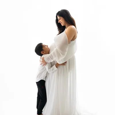 A stunning mommy-to-be with her son, who is hugging her baby bump. Including older siblings in maternity shoots makes for such special and emotional memories.