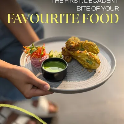 That first, decadent bite of your favorite food is a moment of pure joy. Here, we're serving up some delicious stuffed peppers from our tandoor, paired with a fresh mint chutney.